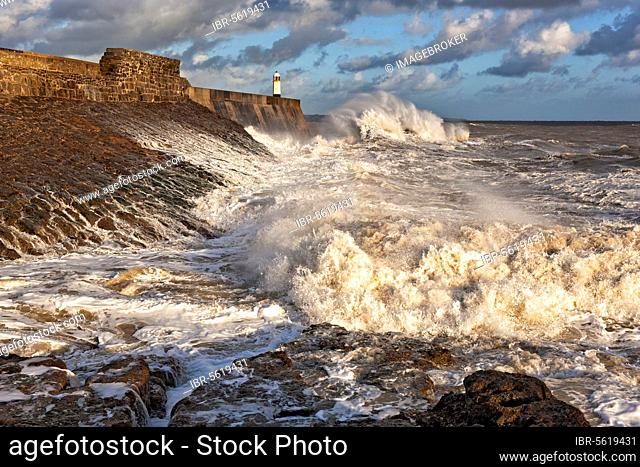Wave-bombed seafront and coastal town lighthouse, Porthcawl Pier, Porthcawl, Bristol Channel, South Wales, Wales