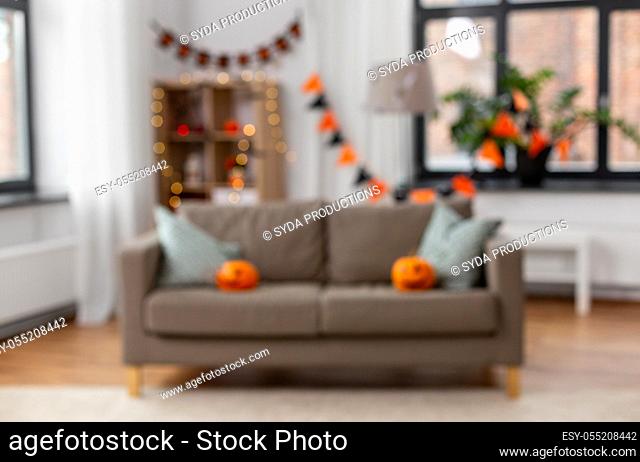 blurred home room decorated for halloween holiday