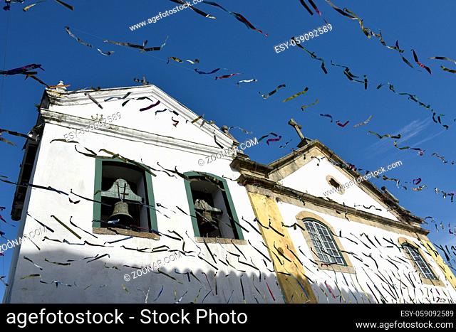 Paraty, Brazil - February 24, 2017: Typical street with colonial buildings in historic town Paraty on the time of Carnival, Brazil