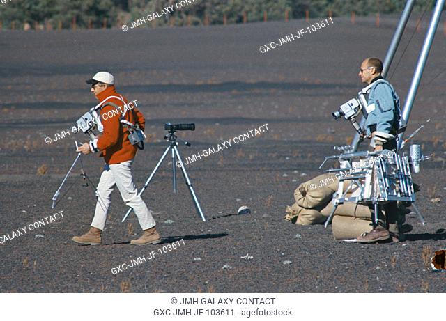 Astronauts Charles Conrad Jr. and Alan L. Bean train for their upcoming Apollo 12 lunar landing mission. Here they are entering a simulated lunar surface area...
