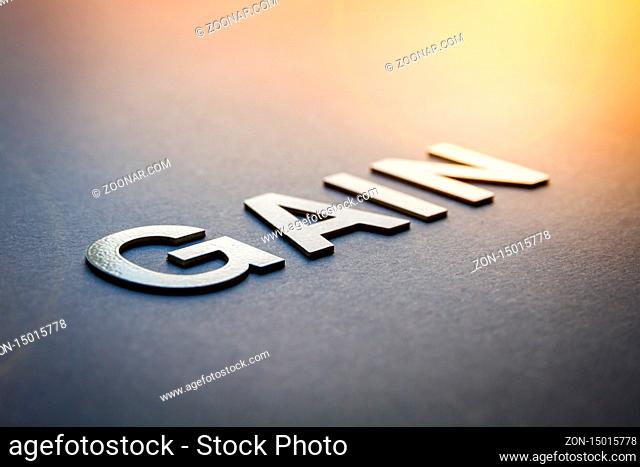 Word gain written with white solid letters on a board