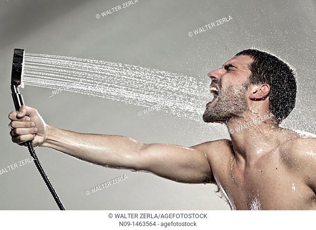 Man play with a shower