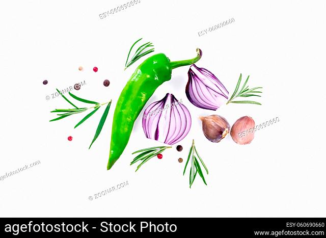 Pod of green hot pepper, two slices of purple onion with sprigs of rosemary, cloves of garlic and peas of colored pepper isolated on white background