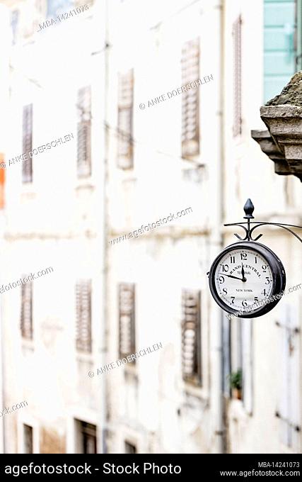 Old fashioned wall clock in the old town of Motovun, Croatia