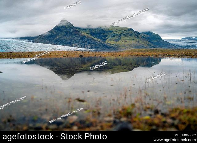 Glacial and reflection in the lake in Fjallsarlon, Iceland