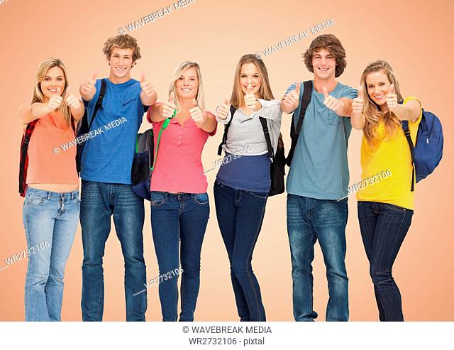 Group of Happy Students againt smiling and raising their thumb at camera agaisnt a orange background