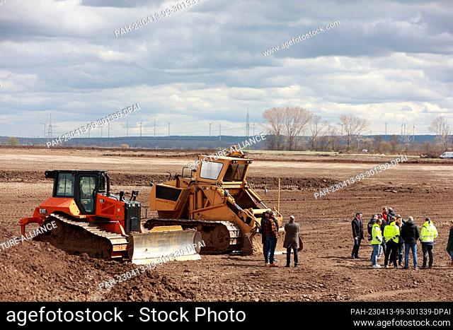 13 April 2023, Saxony-Anhalt, Halberstadt: Heavy construction vehicles stand on the Daimler Truck construction site in Halberstadt