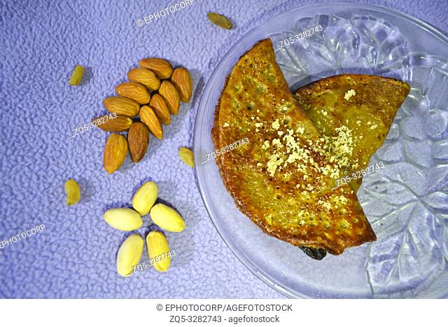 Malpua is a pancake served as a dessert or a snack usuallly made at Holi festival