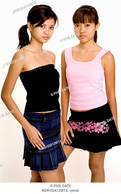 Two teenage girls looking serious