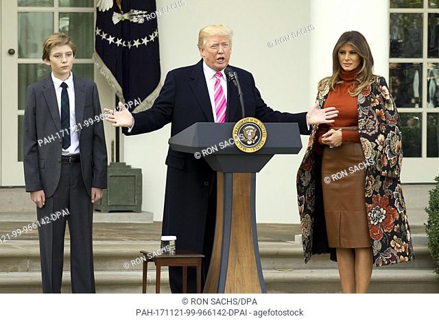 United States President Donald J. Trump, center, makes remarks as Barron Trump, left, and and First Lady Melania Trump, right