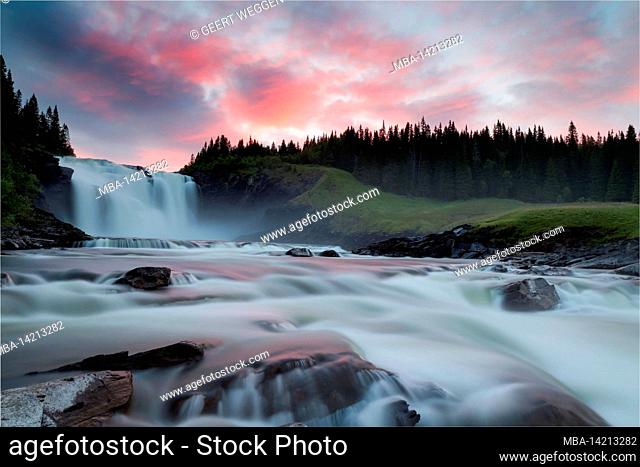 waterfall during sundown with red light