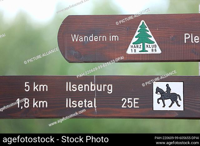 09 June 2022, Saxony-Anhalt, Ilsenburg: Hiking signs stand at Plessenburg Castle in the Harz Mountains. On site, the crisis team forest informed itself about...
