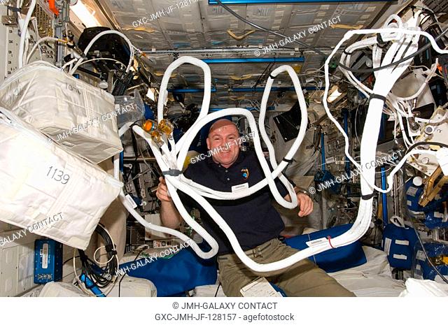 European Space Agency astronaut Andre Kuipers, Expedition 31 flight engineer, works with Anomalous Long Term Effects on Astronauts (ALTEA) equipment in the...