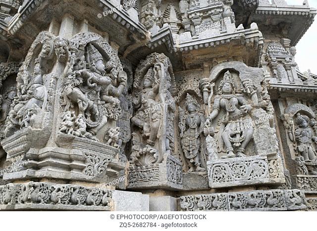 Ornate wall panel reliefs depicting (From left) dancing Shiva, Krishna as Kaliya-mardana and a deity and dancing Parvati, Kedareshwara temple, Halebidu