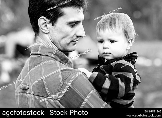 Portrait of happy father and son outdoors