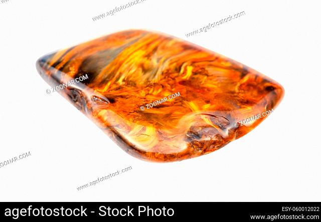 closeup of sample of natural mineral from geological collection - tumbled Pietersite gemstone isolated on white background