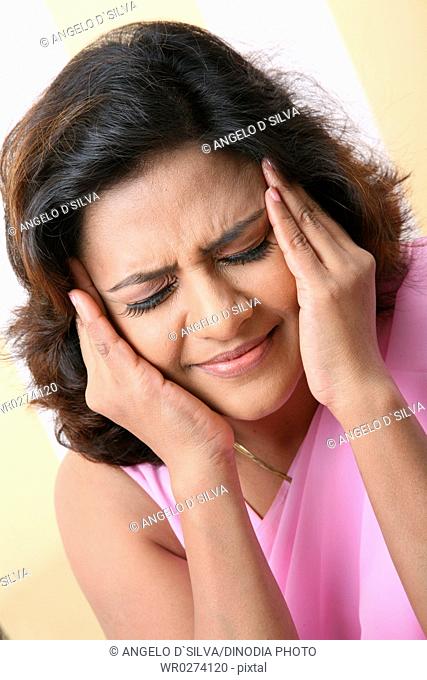 South Asian Indian young lady wearing pink sari feeling irritating MR687N