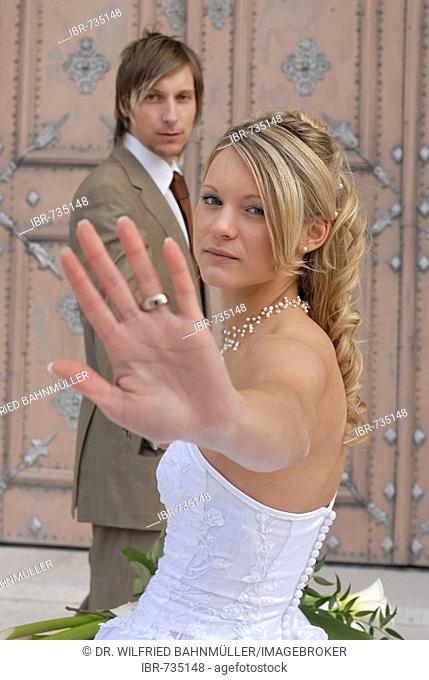 Bride and groom, wedding couple on church steps, gesturing no photographs, no paparazzi