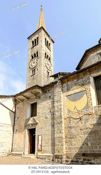 view of entrance and bell tower of Romanesque S. Ambrogio church, shot on bright summer day at Omegna, Verbania, Cusio, Italy