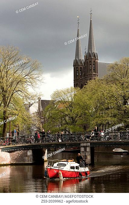 De Krijtberg Roman Catholic church with a boat in the foreground, Single Canal, Amsterdam, Holland, Europe