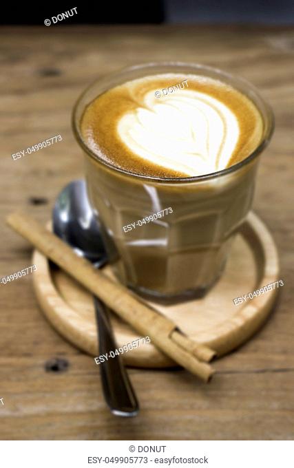 Cup of piccolo latte coffee with latte art, stock photo