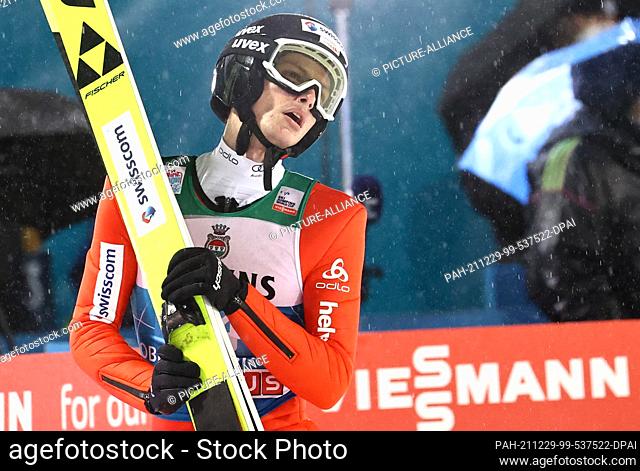 29 December 2021, Bavaria, Oberstdorf: Nordic skiing/ski jumping: World Cup, Four Hills Tournament. Gregor Deschwanden from Switzerland reacts after his jump in...