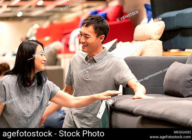 Middle-aged couples to buy sofa