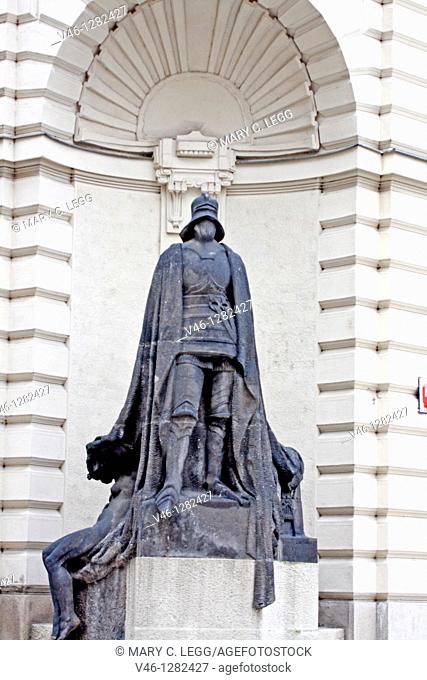 The Iron Knight by Ladislav Saloun at the New Town Hall, Prague near Stare mesto The Iron Knight stands at the cornice of the New Town Hall across from the...