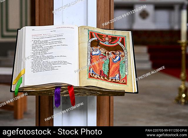 29 June 2022, Brandenburg, Potsdam: An open Bible lies in the Catholic Church of St. Peter and Paul. Photo: Jens Kalaene/dpa
