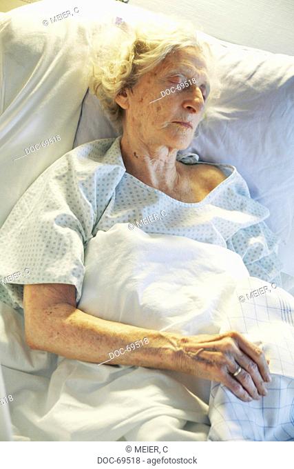 Elderly woman is sleeping in a sickbed