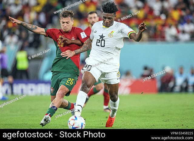 Portuguese Otavio and Ghana's Mohammed Kudus fight for the ball during a soccer game between Portugal and Ghana, in Group H of the FIFA 2022 World Cup in Doha