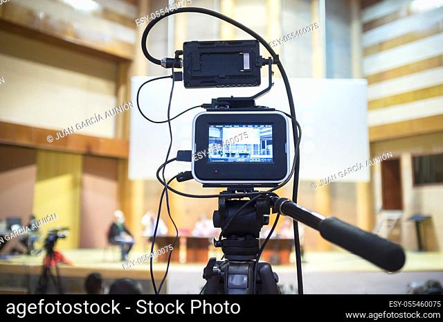 Camera taking live video streaming at event. Technology live streaming and broadcast concept. Selective focus