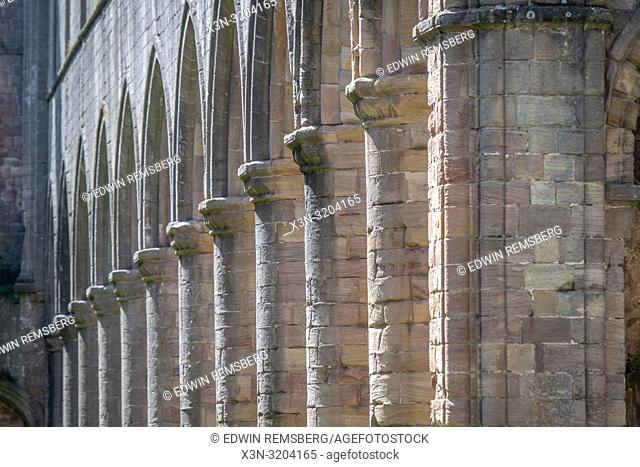 Row of columns repeat along the facade of the Fountains Abbey, Ripon , Yorkshire, UK