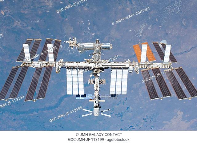 The International Space Station is featured in this image photographed by an STS-134 crew member on the space shuttle Endeavour after the station and shuttle...