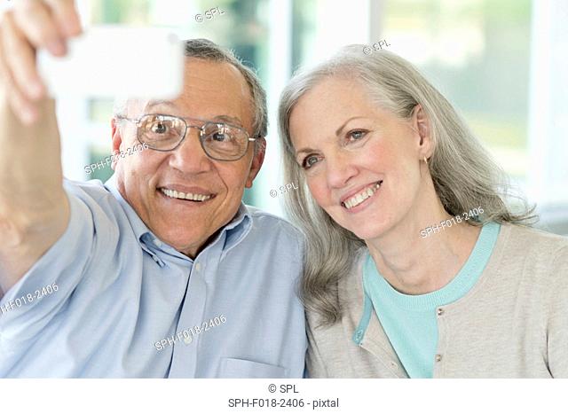 Portrait of senior couple taking selfie on phone