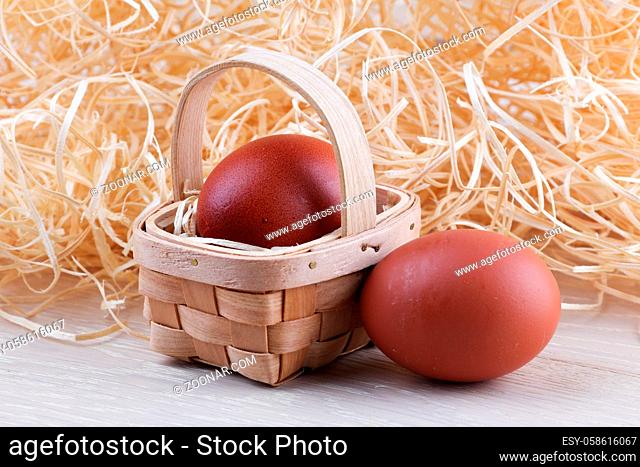 Two eggs basket wood straw