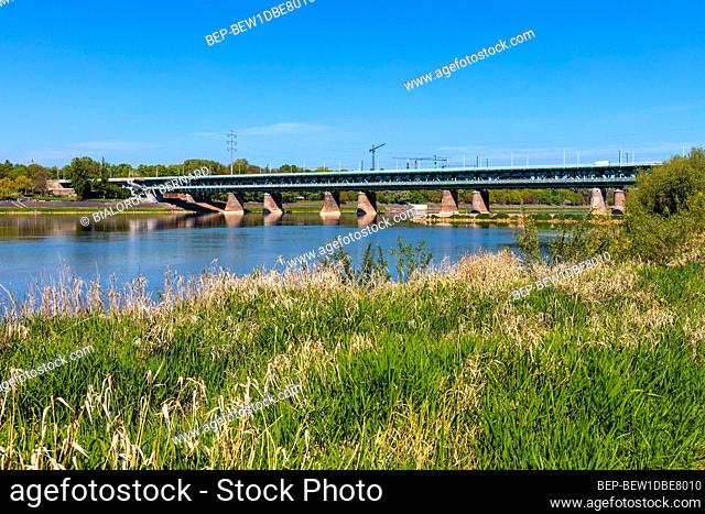 Warsaw, Mazovia / Poland - 2020/05/09: Panoramic view of Gdansk Bridge - Most Gdanski - two-deck steel truss construction over Vistula river in northern part of...