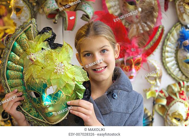 Carnival in Venice, Italy. Portrait of beautiful girl with venetian mask