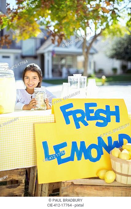 Portrait of smiling girl at lemonade stand