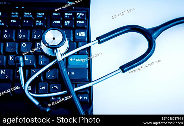 Electronic medical, stethoscope on PC/Laptop/Keyboard? blue toned images