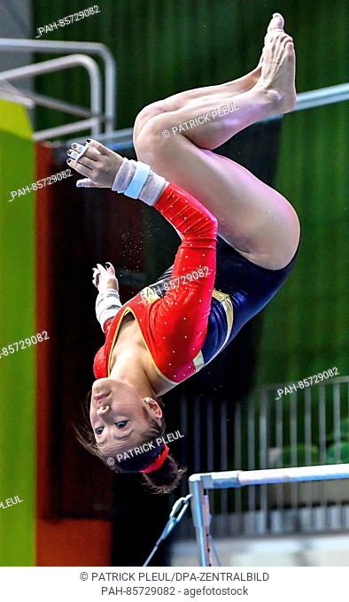 16-year-old German gymnast Kim Janas (MTV Stuttgart) on the uneven bars ahead of the qualification at the Tournament of Champions in Cottbus,  Germany