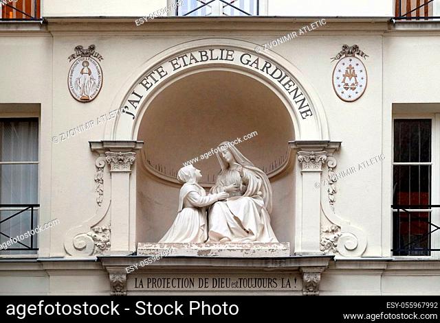 Statue of St Catherine and the Virgin Mary outside the Chapelle Notre Dame de la Medaille Miraculeuse in Paris, France