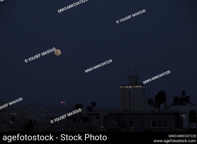 The full ""pink moon"" rises over Gaza City in the middle of Ramadan. This astronomical phenomenon can be seen in the full moon during the month of April from...