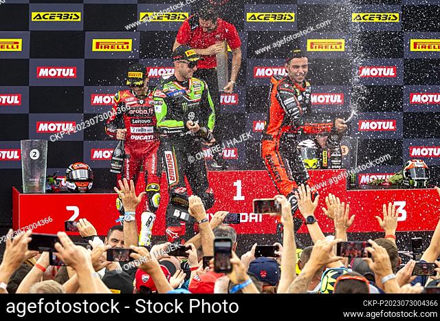 L-R first Alvaro Bautista from Spain, third Jonathan Rea from Britain and second Danilo Petrucci from Italy celebrate on the podium after Race 2 during the 2023...