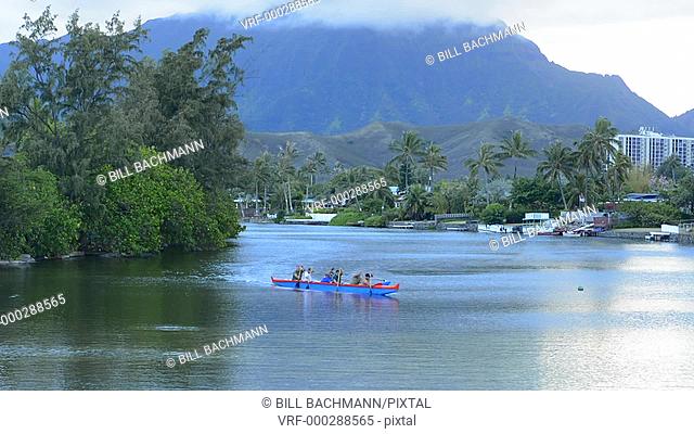 Kailua Hawaii Oahu canoe club rowing on Outrigger Canoes in bay practice sports athletics exercise