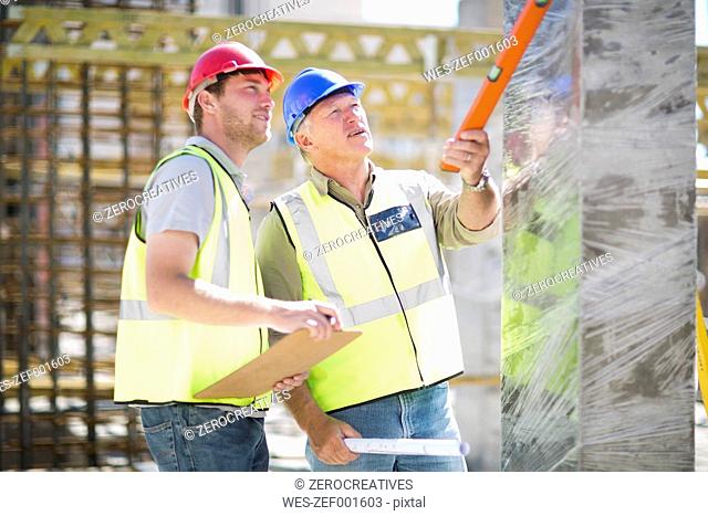 Two construction workers in construction site