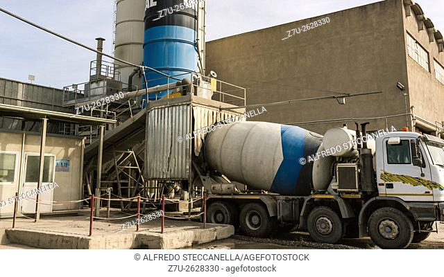 Catania - Sicily - Industrial area: The trucks waiting to load cement from silos