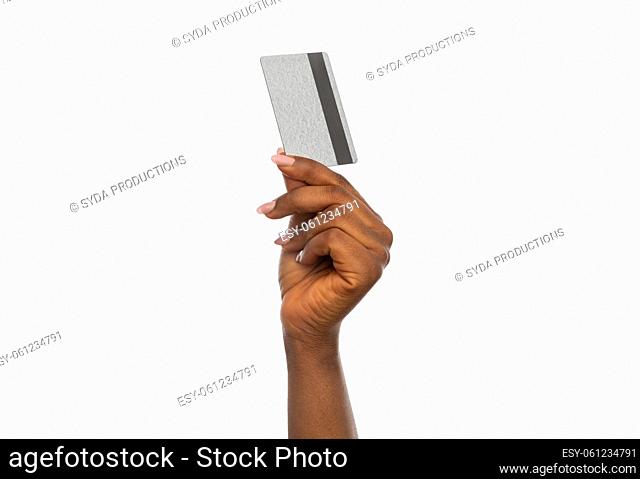 close up of hand with silver credit card