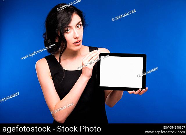 a girl with the tablet on a blue background