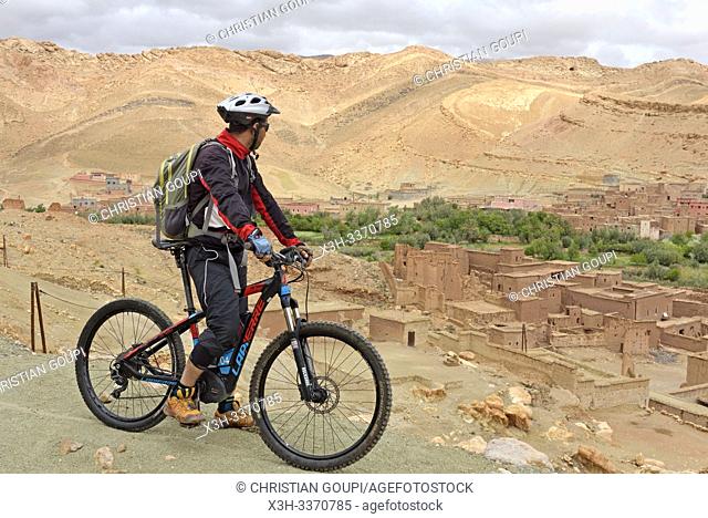riders on mountain bike with electric assistance, Ounila River valley, Ouarzazate Province, region of Draa-Tafilalet, Morocco, North West Africa